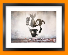 Banksy Bomb Hug Framed Print